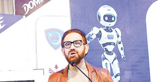 Speaker presenting in front of a robot backdrop